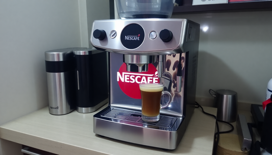 Modern Nescafe coffee machine brewing fresh coffee with glass cup on kitchen counter Nescafe coffee machine supplier Guwahati