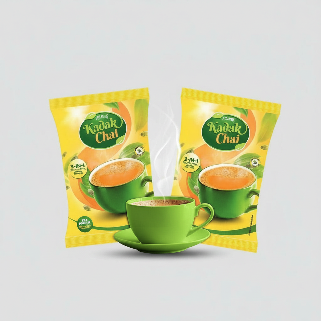 Atlantis Kadak Tea Premix 1 kg yellow packets with green cup filled with steaming tea