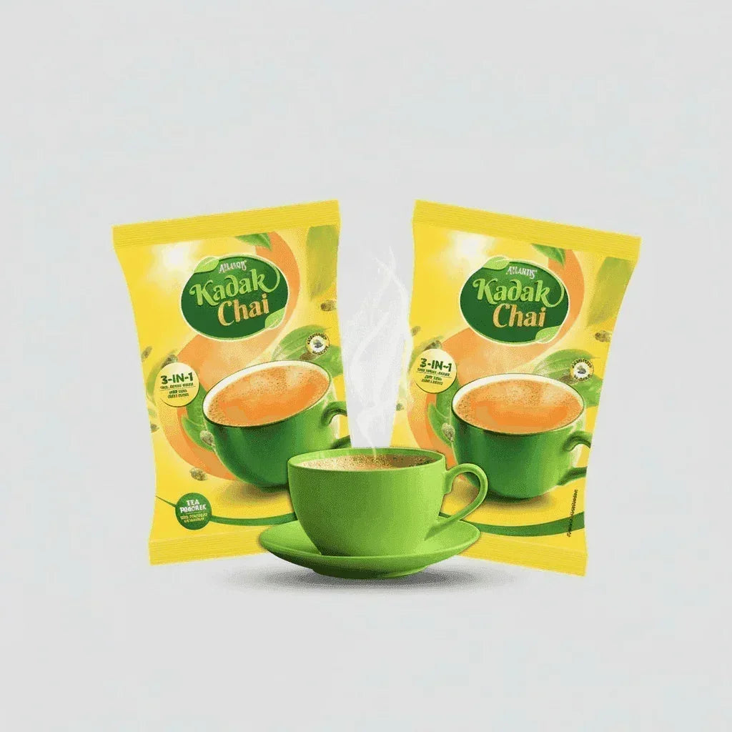Atlantis Kadak Tea Premix 1 kg yellow packets with green cup filled with steaming tea