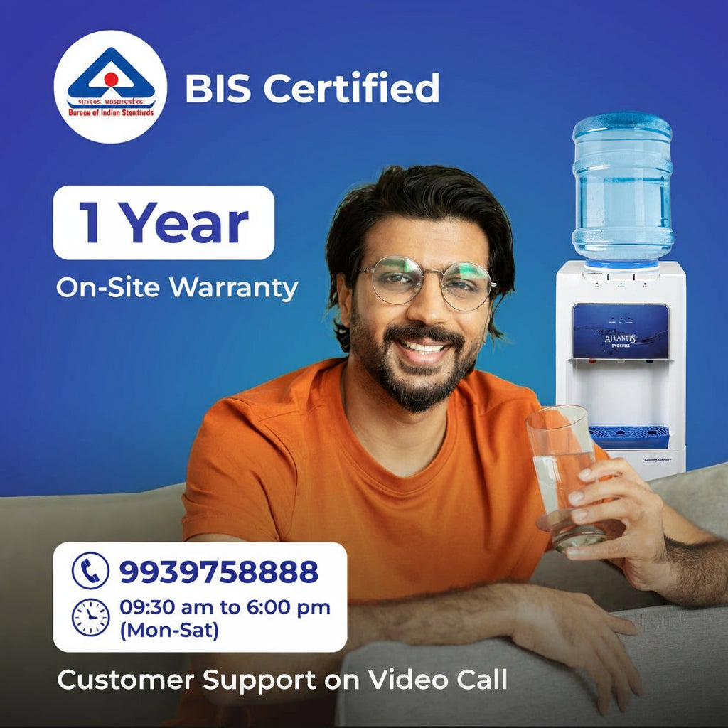 Smiling man holding a glass of water next to an ATLANTIS PRIME water dispenser with BIS certification and one year warranty