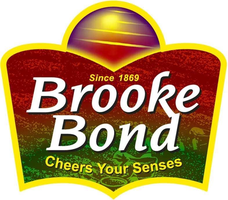 Brooke Bond tea logo featuring red green and yellow colors with yellow text and sun graphic