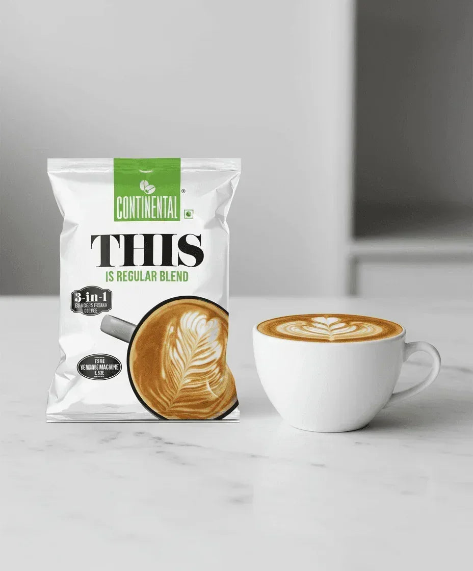 Continental 3 in 1 coffee premix 1 kg pack with cup of latte coffee on white marble surface