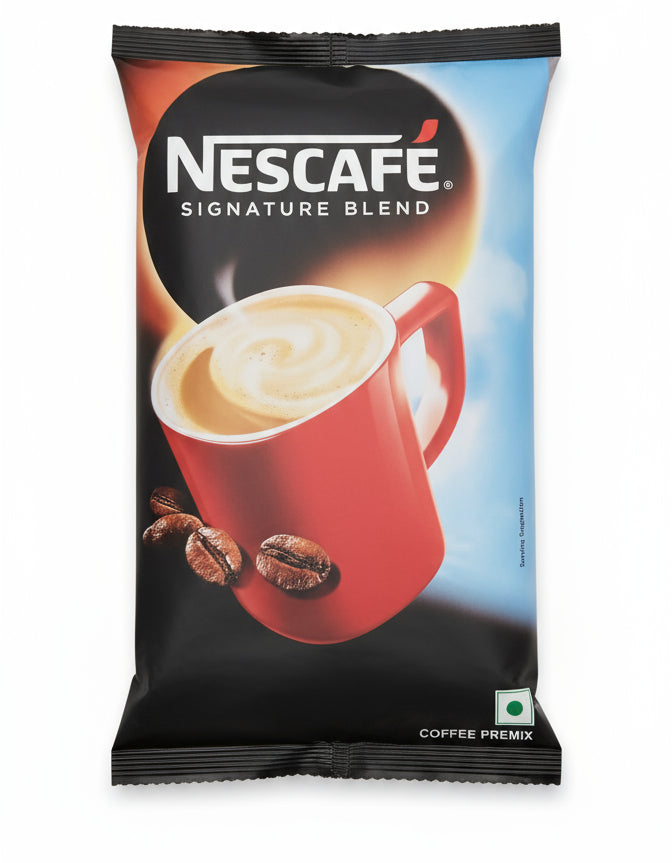 Nescafe Signature Blend 1kg premix coffee pack with red cup and coffee beans on black and blue background