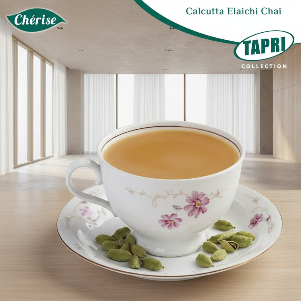 Cup of Calcutta Elaichi chai with cardamom pods on floral saucer showcasing Calcutta Elaichi chai 1kg price