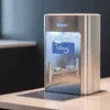 Atlantis Prime water dispenser review showing sleek stainless steel design dispensing water