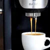 Tata Barista chai machine brewing fresh chai into a white cup