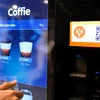 Coffee vending machine dispensing coffee premix in cups