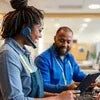 Customer service agents using Atlantis coffee machine during office break