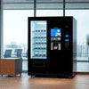 Tea coffee vending machine supplier Noida modern black vending machine with snacks and beverages indoors
