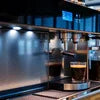 Duty coffee vending machine Sector 18 Noida brewing fresh coffee with cups placed under dispenser