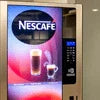 Nescafe signature blend supplier in Gaur City vending machine with coffee cup image