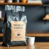 Amazon premium coffee price Noida premium coffee bag with cup placed on wooden surface