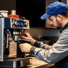 Technician performing coffee machine repair Greater Noida on espresso machine in workshop