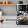 Coffee machine rental in Chandni Chowk black espresso machine making coffee on kitchen counter