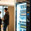 Automatic coffee vending machine Noida Sector 63 model in office setting with employees using it
