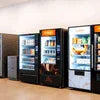 Refrigerated vending machines stocked with beverages from Amazon tea premix supplier in Delhi