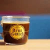 Bru Tripti coffee premix glass jar with brown label on wooden surface showing how to use Bru Tripti coffee premix