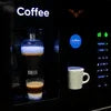 Office coffee vending machine Delhi dispensing a fresh cup of coffee with illuminated control panel