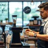Barista preparing coffee using coffee premix service in Gurgaon at a cafe counter
