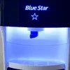 Blue Star water dispenser for office glowing with blue light on front panel