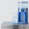 Blue Star automatic water dispenser Noida model dispensing clear water into a glass on a table