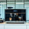 Atlantis coffee machine Noida black model brewing fresh coffee on kitchen counter