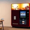 tea coffee vending machine service Delhi NCR with digital display and beverage options in office setting