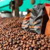 Tata Sonnets coffee beans wholesale price Noida packaged coffee beans with roasted beans scattered