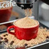 Nescafe coffee machine price in Noida shown with red cup and coffee powder