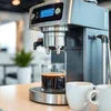 Coffee machine rental Noida black espresso maker brewing fresh coffee in modern kitchen