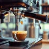 Best coffee machine in Noida brewing fresh espresso with crema in a glass cup