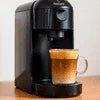 Nescafe coffee machine brewing a cup of coffee with milk froth best Nescafe coffee machine in Delhi