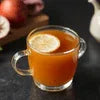 Clear glass cup of hot tea with lemon slice showcasing Amazon no added sugar tea options