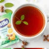 Nestle tea premix 1kg price Noida with a cup of brewed tea and tea premix packet
