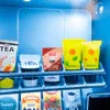 Tea premix supplier in Delhi NCR showcasing packaged tea premix varieties on a store shelf