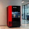 Tea coffee machine on rent in Noida with sleek red and black vending design in modern office space