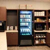 Coffee premix supplier Noida branded refrigerated display with various coffee premix products on shelves
