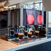 Atlantis cold coffee machine for offices in Delhi serving fresh coffee in multiple glasses on a countertop
