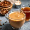 Masala tea premix for vending machines served in glass cups with spices and coffee beans