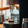 Modern coffee machine Noida for office brewing fresh espresso with glass cup