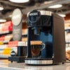 Nescafe coffee machine supplier black compact model brewing espresso coffee cup at cafe