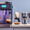 Coffee machines on kitchen counter showcasing different models for brewing with coffee machine price in Delhi