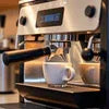 Coffee machine Maldev espresso brewing with cup underneath and steam wand