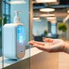 ATLANTIS COFFEE MACHINE 7 OPTION dispensing liquid soap into hand at a modern sink