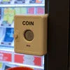 Coin slot on a coffee vending machine with display panel in the background for Best Coffee Vending Machines