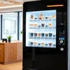 Atlantis Coffee Machine Greater Noida NEAR ME touchscreen interface with coffee selection in modern cafe