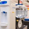 White water dispenser and black coffee machine under 10000 price on office counter