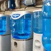 Water dispenser units lined up for Office Coffee Machine RENTAL in office breakroom