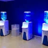 Atlantis premium coffee vending machines with illuminated water dispensers in dark setting