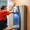 8 Option Vending Machine model being serviced by technician for maintenance and repair